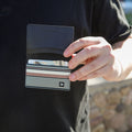 Black, brown, and cream striped bifold wallet